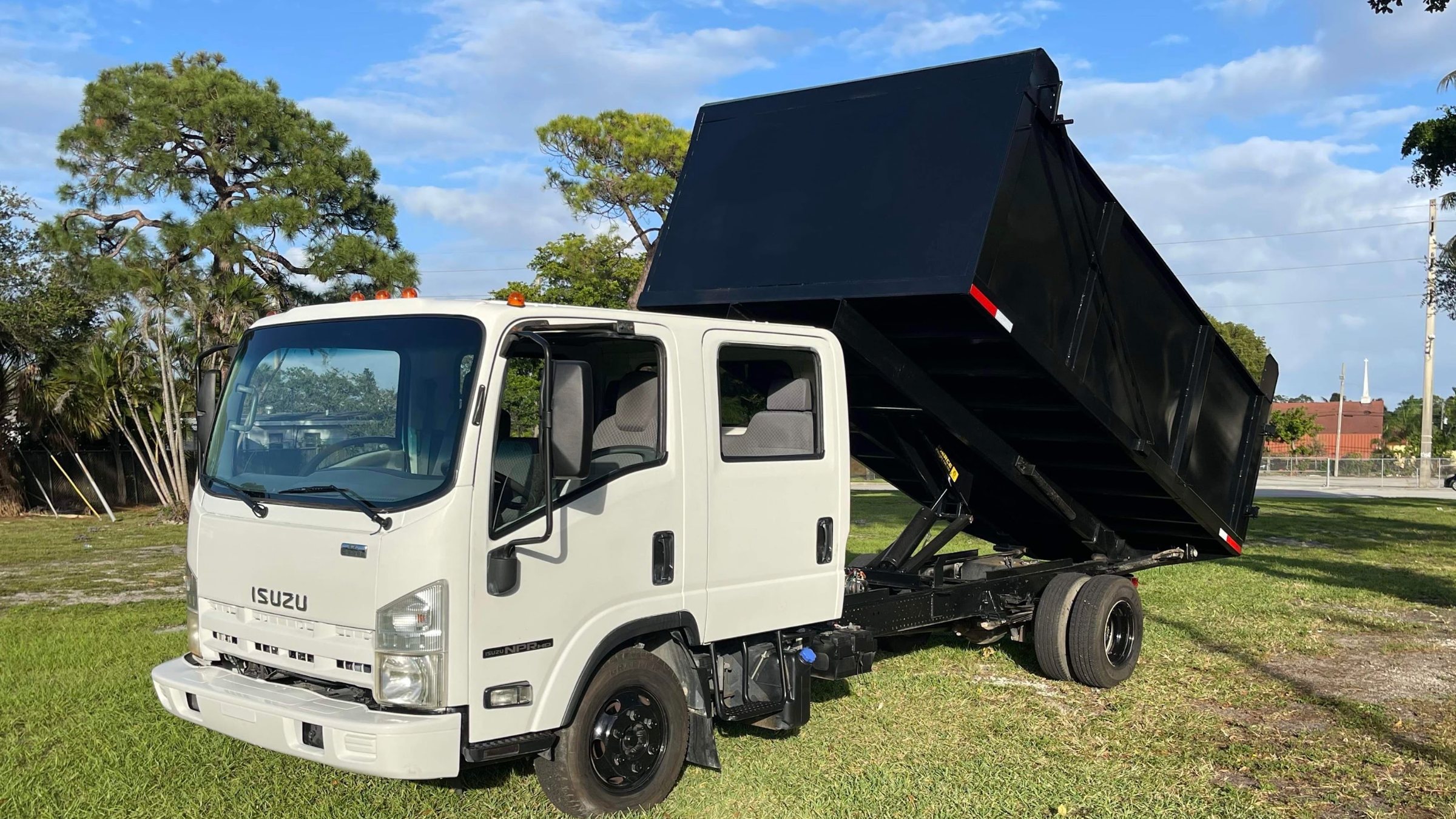 Loaded junk removal truck leaving a job in Broward County FL